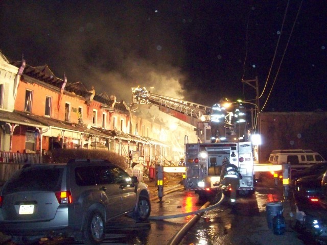 Tower Ladder 28 operating at an 8 alarm fire on Fleetwood Street